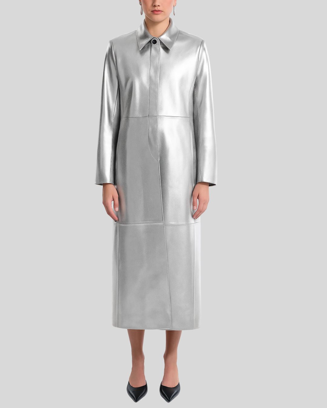 Model wearing a silver metallic leather trench coat for women, full front view