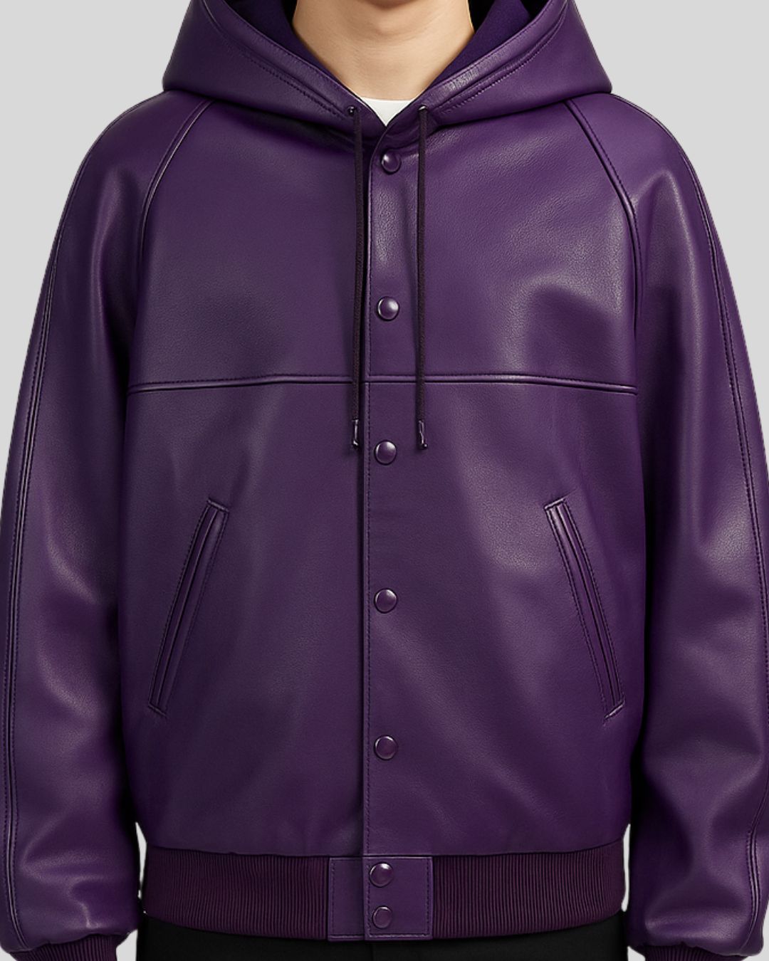 Close-up of front snap-button and pockets on purple bomber