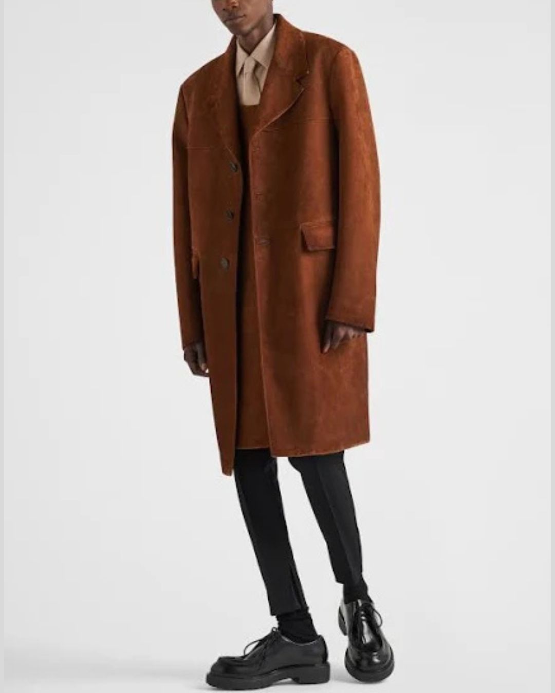 Full body styled shot of man wearing brown suede trench coat