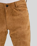 close-up detail of suede pants texture and stitching