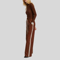 side view of brown leather wide leg pants with stripe