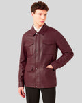 Burgundy leather jacket with hand in pocket close-up