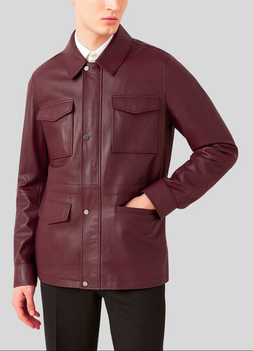 Burgundy leather jacket with hand in pocket close-up