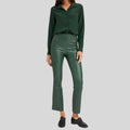 front view of women's green leather pants with flare