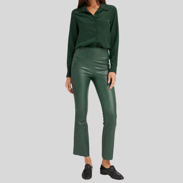front view of women's green leather pants with flare