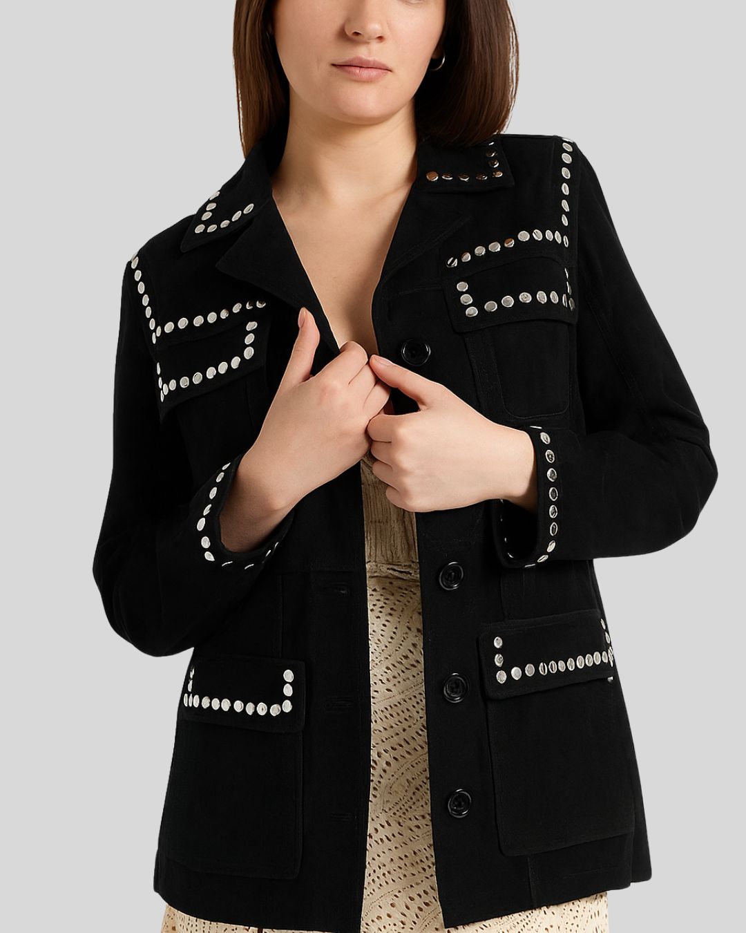 Black jacket with silver studs on a plain background