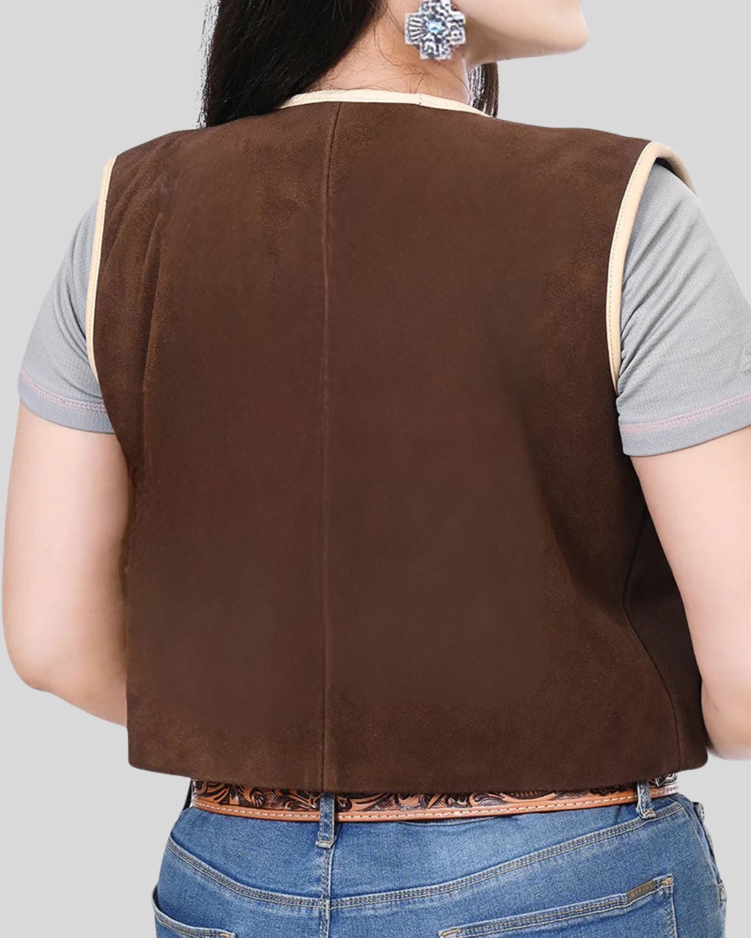 Woman wearing brown Wild Ember suede fringe vest, front view
