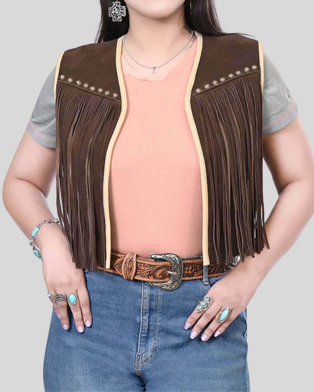 Woman wearing brown Wild Ember suede fringe vest, front view
