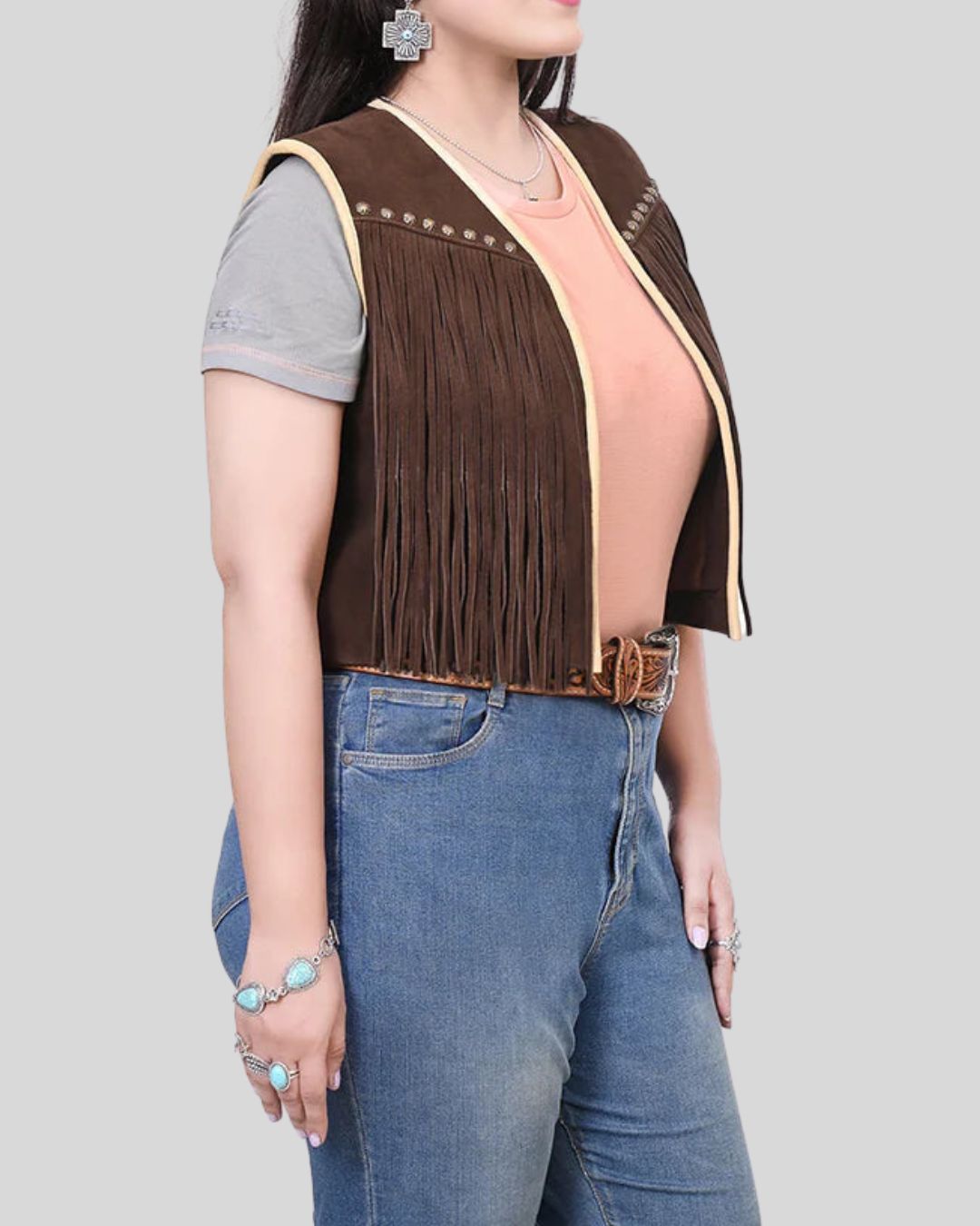 Woman wearing brown Wild Ember suede fringe vest, front view
