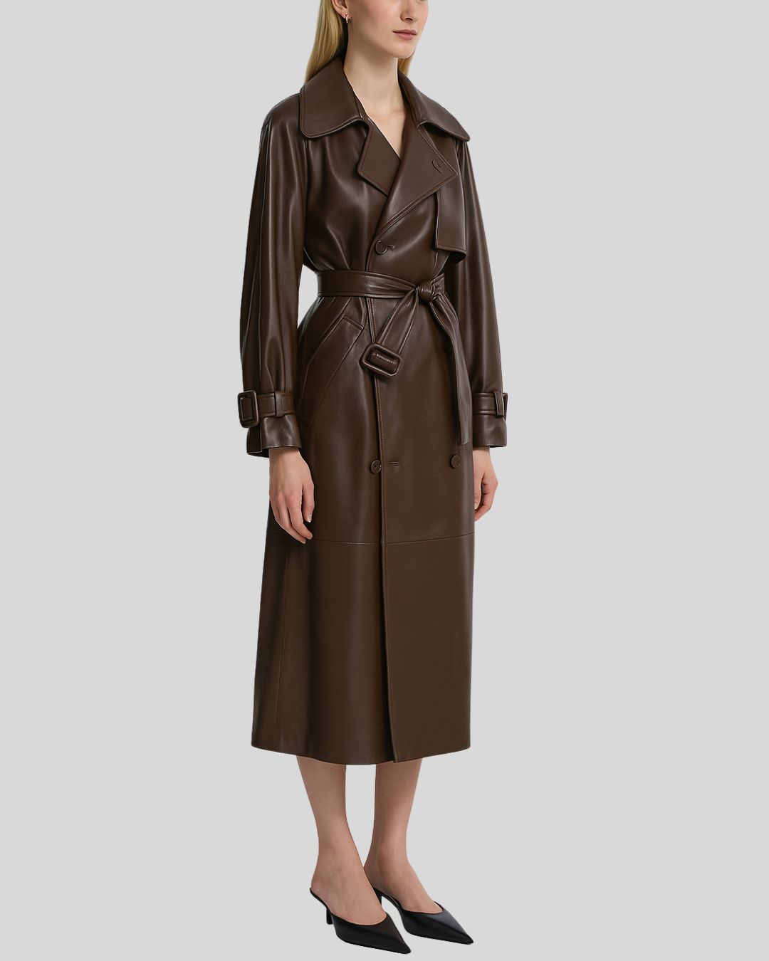 Front view of brown leather trench coat for women with belt and double-breasted closure