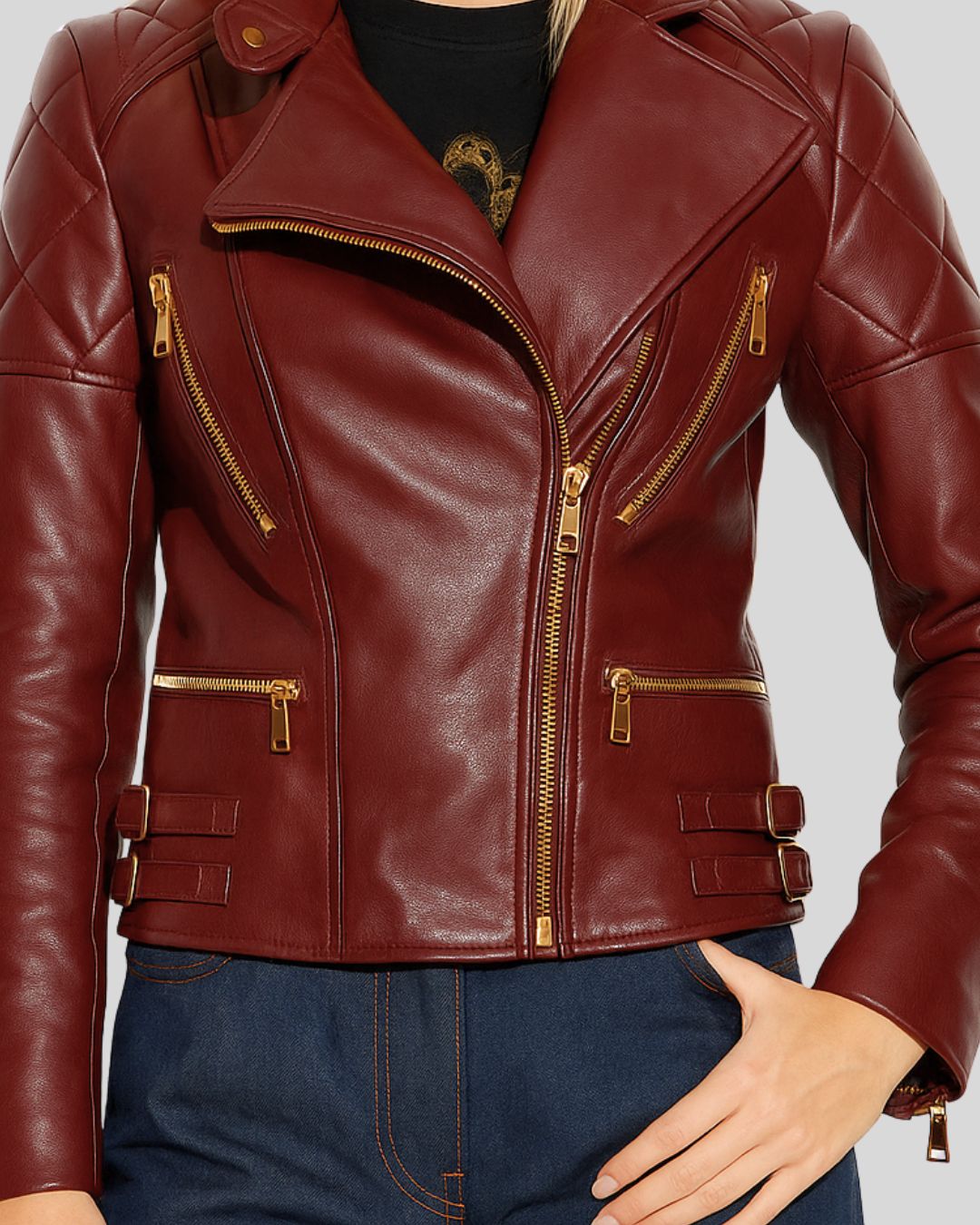 Front view of oxblood leather biker jacket for women with quilted shoulders and gold zippers