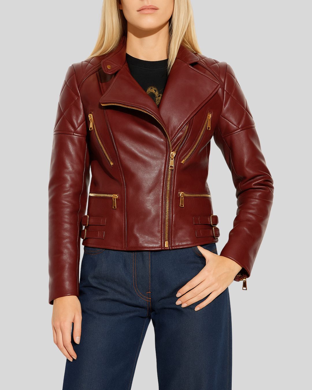 Front view of oxblood leather biker jacket for women with quilted shoulders and gold zippers