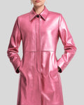 Women's pink leather long coat with hands in pockets