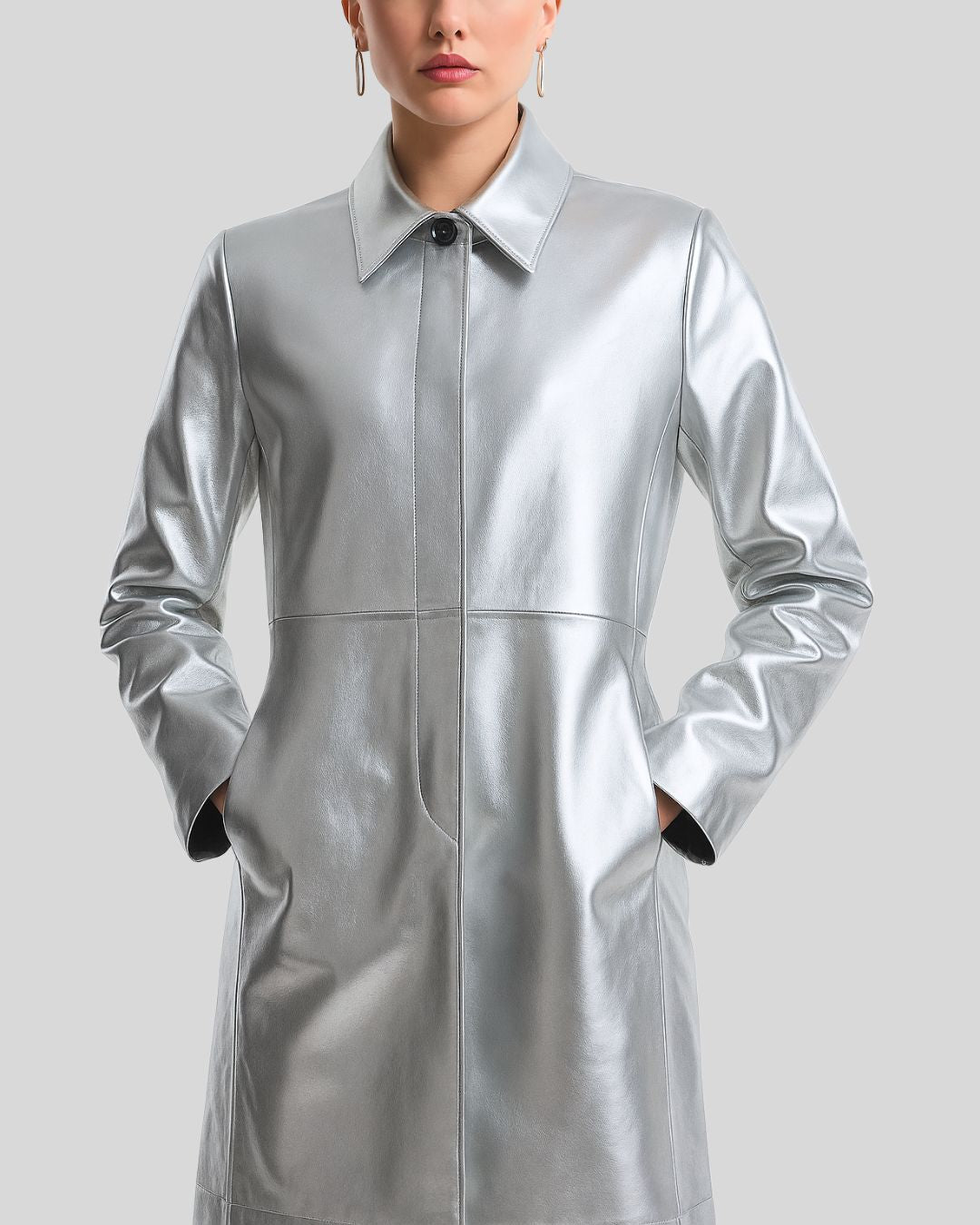 Women's silver leather long coat with hands in pockets