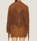 Brown suede jacket with fringe details on a plain background